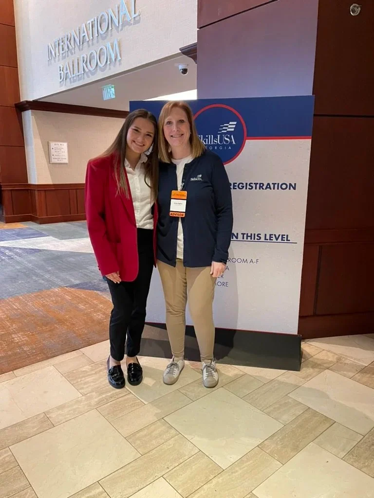 Sara Elise at State SkillsUSA 2023 with advisor Cona Hughes